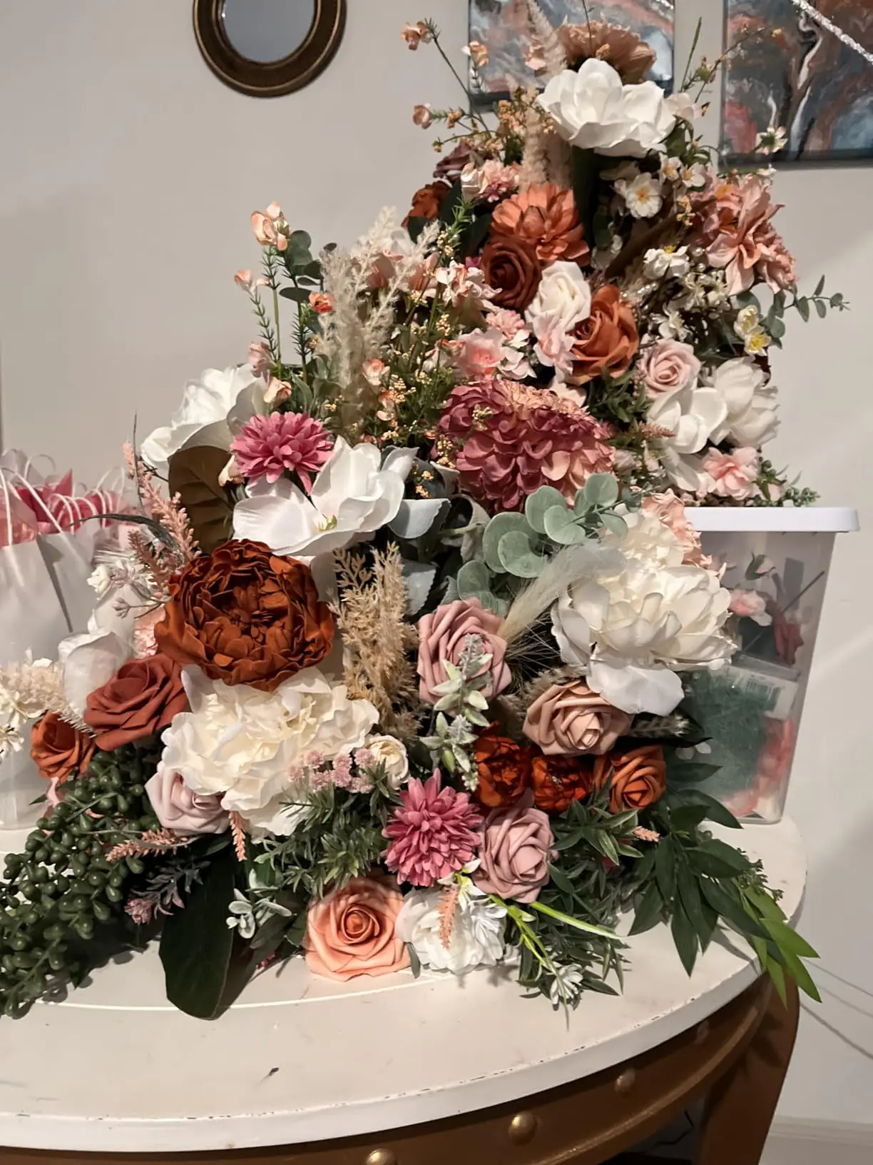 Terracotta vintage burnt edge peonies in a large autumn arrangement with white magnolias and dusty rose blooms