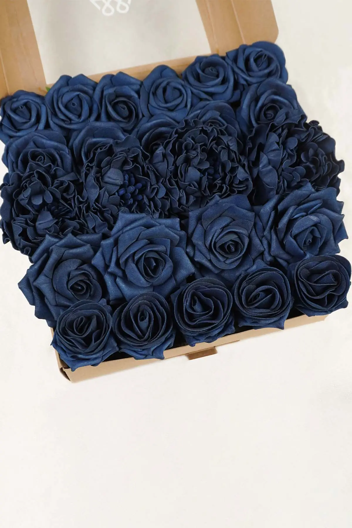 Navy blue artificial flower box with faux roses for DIY wedding centerpieces and home decor
